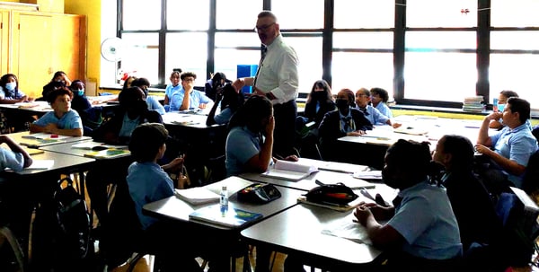 students in classroom with superintendent mccormack